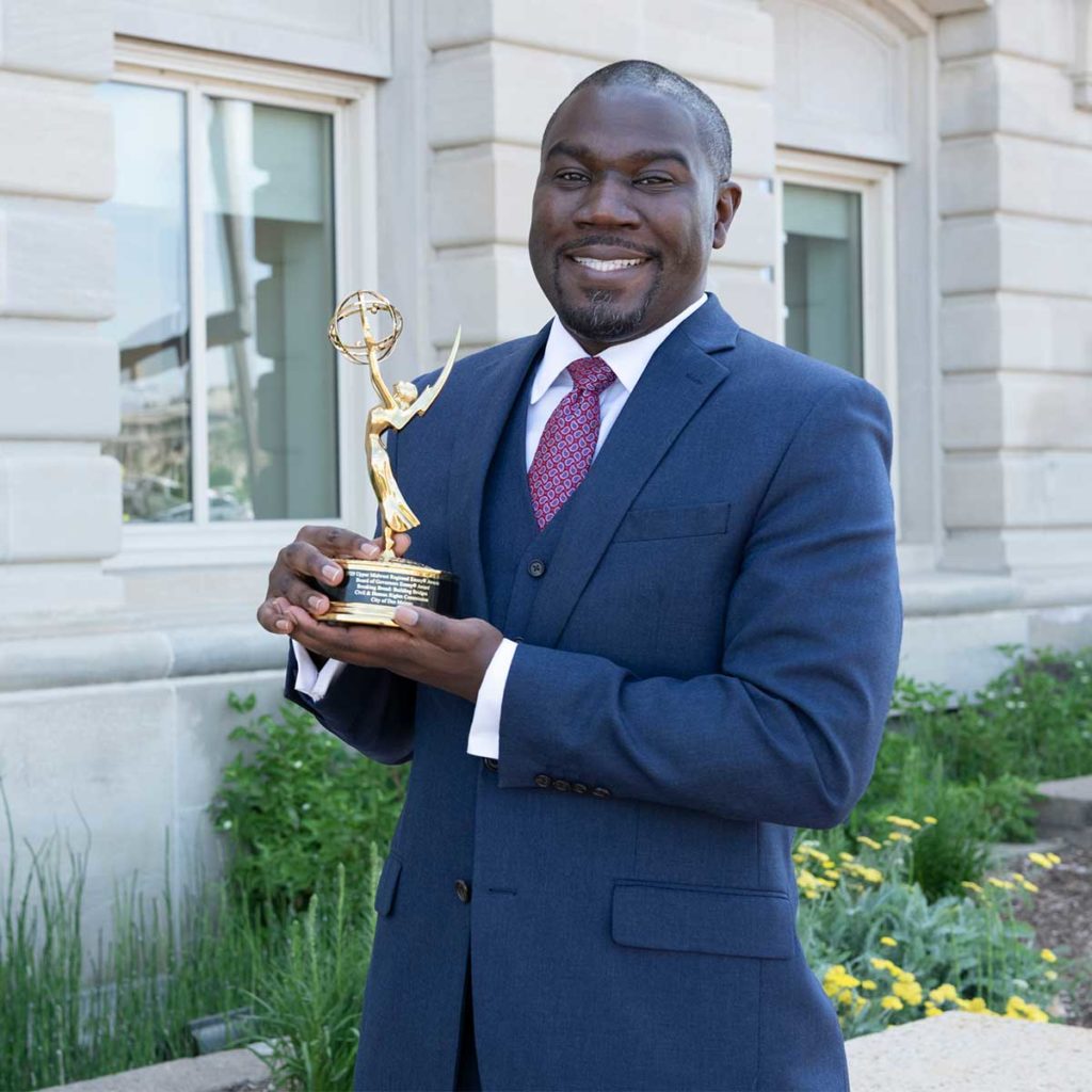 Joshua V. Barr with his Emmy for Breaking Bread, Building Bridges